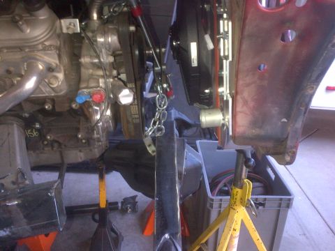 1985 Jeep CJ7 - Engine and chassis components are visible, supported by jack stands during work.