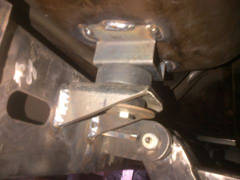1985 Jeep CJ7 - Detail of a suspension mounting bracket, likely part of an aftermarket modification.