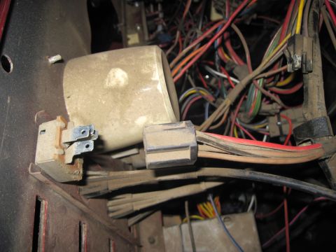 1985 Jeep CJ7 - A complex network of dusty wires and connectors is visible within the vehicle's interior.