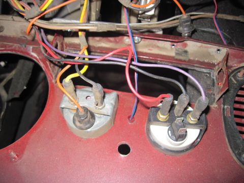 1985 Jeep CJ7 - Wiring harness connected to gauges on a red vehicle's dashboard.