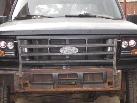 1983 Ford Bronco - Crossbars going in. It looks like the body might be ~1/16" low on the driver's side because the bumper is dead-square to the frame. Th…