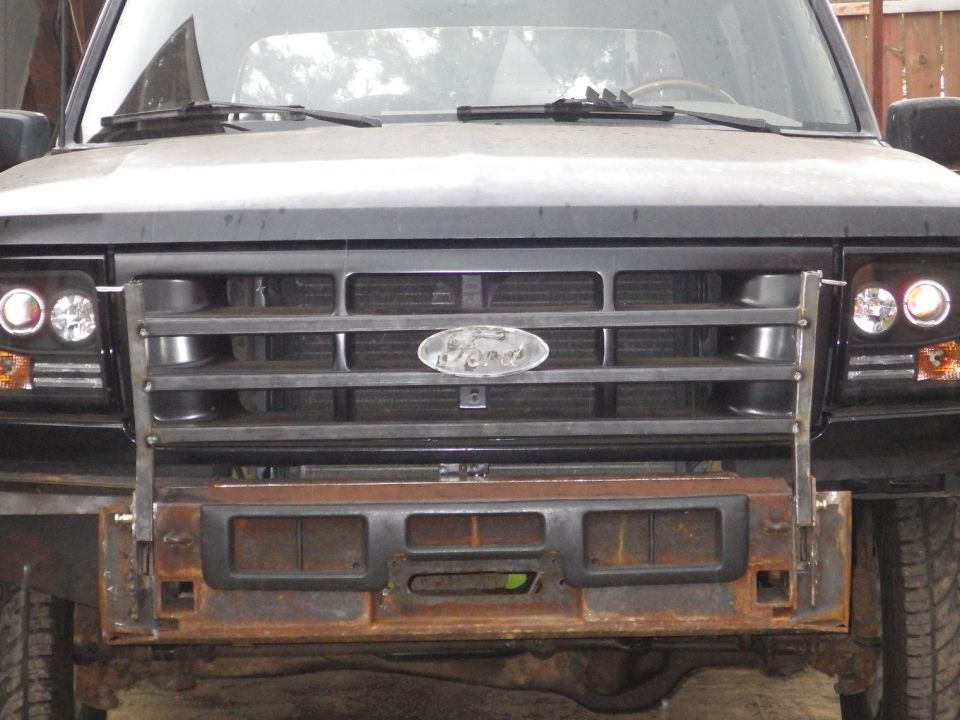 Crossbars going in.  It looks like the body might be ~1/16" low on the driver's side because the bumper is dead-square to the frame.  The oval is just there temporarily - I'll center & align it later when I weld it on permanently.