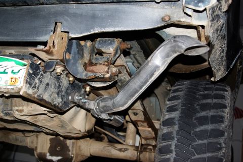 1995 Ford Bronco - Custom exhaust pipe installation visible on the underside of a vehicle.
