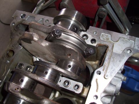 1995 Ford Probe - Close-up view of an engine's internal components, including the crankshaft and connecting rods.