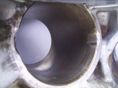 1995 Ford Probe - Engine cylinder bore shows signs of wear and possible corrosion.