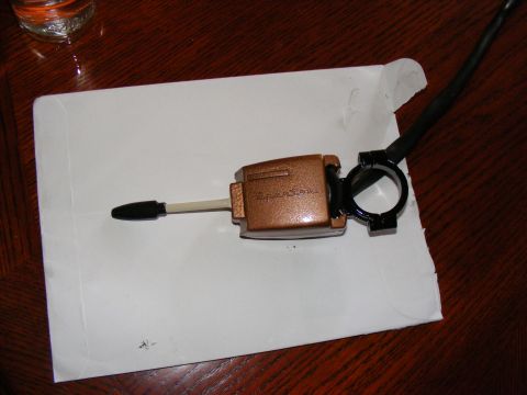 Copper turn signal lever with black handle and mounting bracket