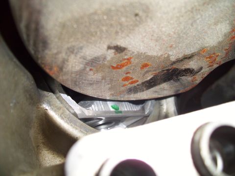 1995 Ford Probe - Detail shot of a vehicle's suspension component, showing springs and a small green marking.