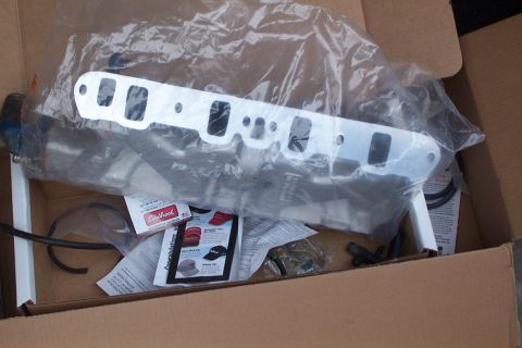 1980 Ford Bronco - Unboxed Edelbrock intake manifold and associated parts, ready for installation.