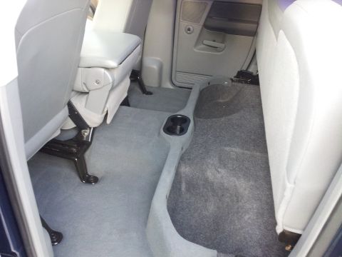 2007 Dodge 1500 - Back seat and floor of a vehicle interior.