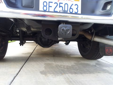 2007 Dodge 1500 - The rear underside of a pickup truck, including the axle and exhaust pipe, is visible.