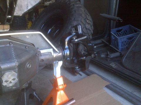 1985 Jeep CJ7 - Close-up of a Jeep Dana 44 axle assembly, possibly undergoing modification or repair.