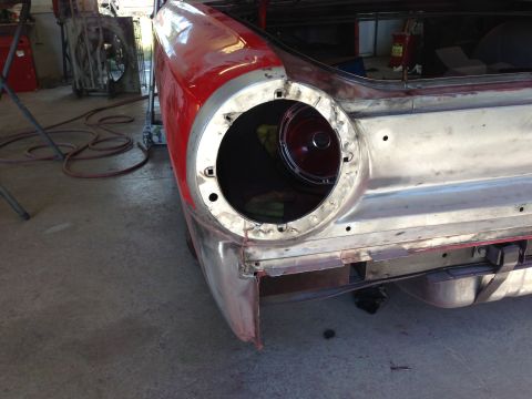 1964 Ford Fairlane - Rear quarter panel of a 1964 Ford Fairlane undergoing restoration, with the taillight assembly removed.