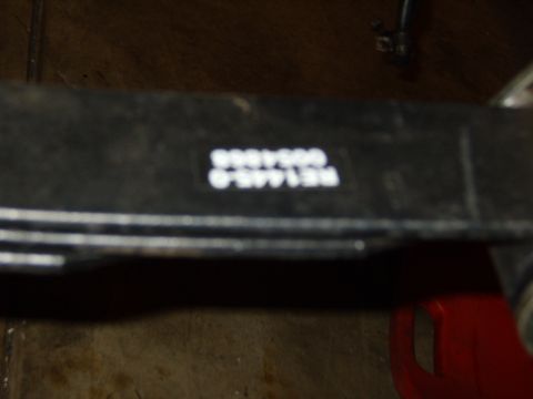 1985 Jeep CJ7 - A black metal part with white lettering is visible, showing part numbers and codes.