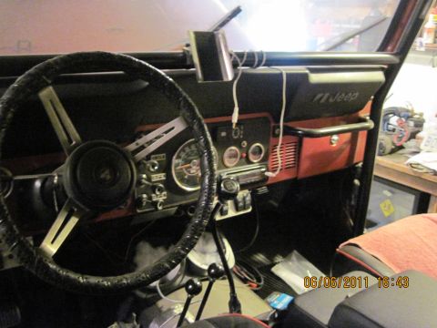 1985 Jeep CJ7 - Interior view of a Jeep CJ showing the dashboard, steering wheel, and roll bar. A timestamp indicates the photo was taken on 06/06/2011.