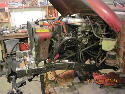 1985 Jeep CJ7 - Jeep CJ7 engine bay work in progress, showing engine and front suspension components.