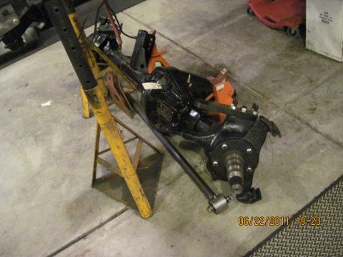1985 Jeep CJ7 - Front axle assembly on jack stands, with a tag on the differential housing. Date stamp reads 06/22/2011.
