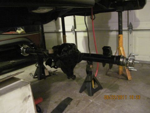 1985 Jeep CJ7 - Rear axle assembly is supported by jack stands in a garage setting. A date stamp is visible in the lower right corner.