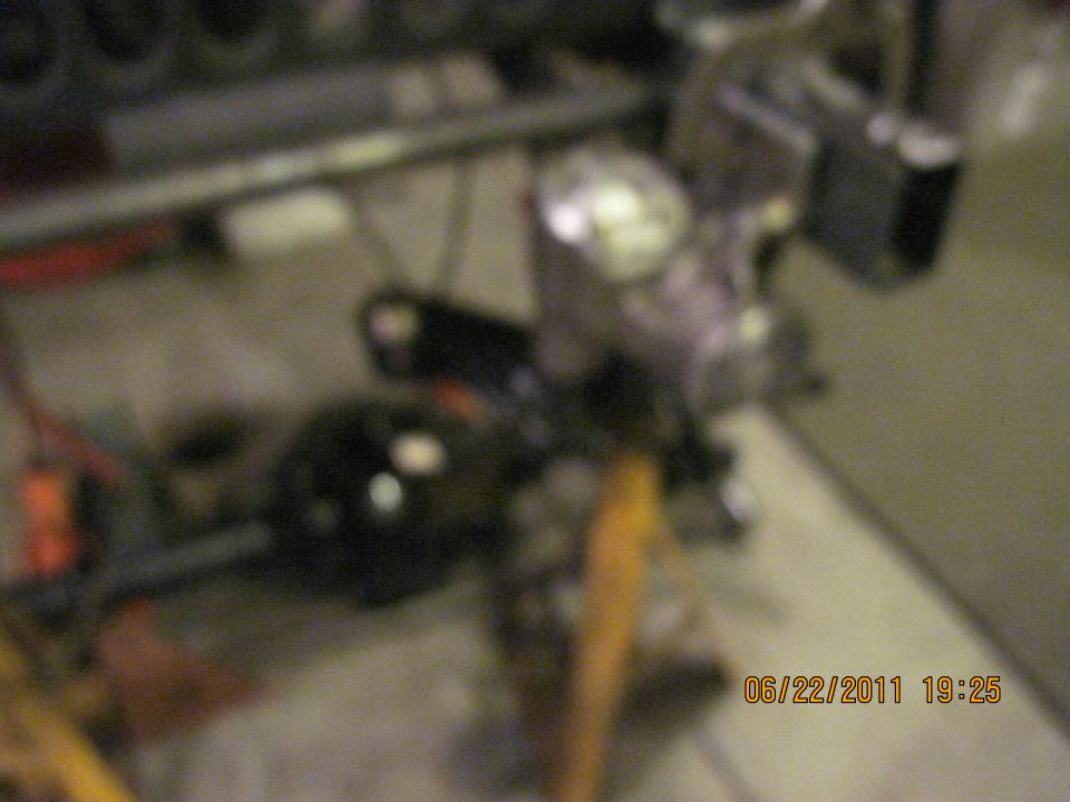 close-up of vehicle drivetrain parts, possibly a differential and suspension components