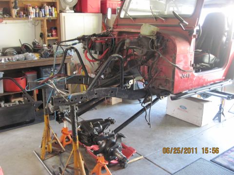 1985 Jeep CJ7 - 1985 Jeep CJ7 undergoing restoration, with the front end removed and body supported by jack stands.