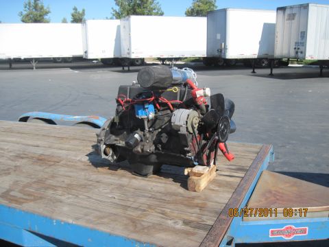 1985 Jeep CJ7 - Engine removed from a vehicle and placed on a trailer for transport.