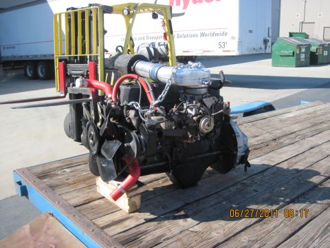 1985 Jeep CJ7 - Engine on a pallet, with a forklift in the background. Date stamp reads 06/27/2011.