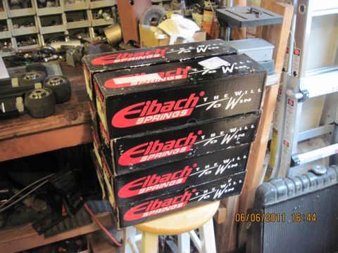 1985 Jeep CJ7 - Boxes of Eibach Springs are stacked on a stool in a workshop setting.
