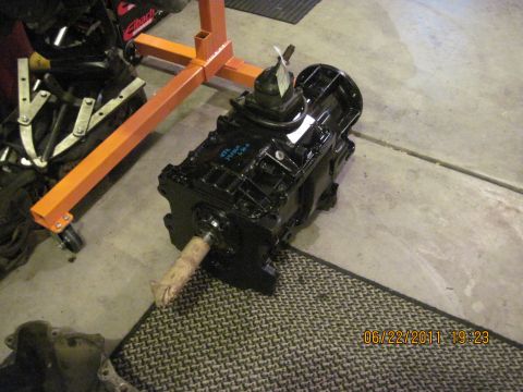 1985 Jeep CJ7 - A rebuilt transmission is shown on a mat with an engine stand in the background. The date 06/22/2011 is visible.