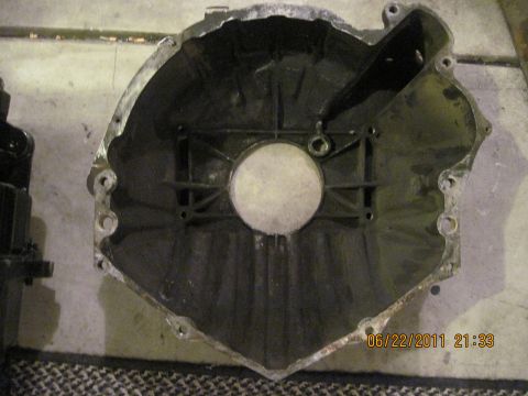 1985 Jeep CJ7 - Close-up of a transmission bell housing, showing internal structure and mounting points.