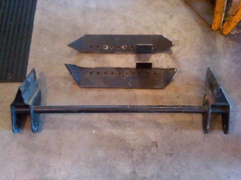 1985 Jeep CJ7 - Custom suspension components are displayed on a concrete surface, likely for a Jeep CJ7 build.
