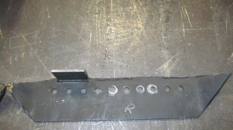 1985 Jeep CJ7 - Custom metal bracket with a welded tab and drilled holes, likely for automotive use.