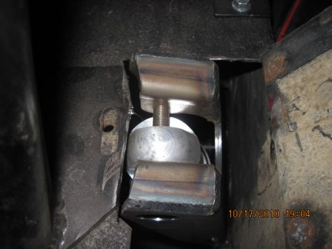 1985 Jeep CJ7 - A close-up view of a vehicle's suspension system, showing a metal component with a bolt.