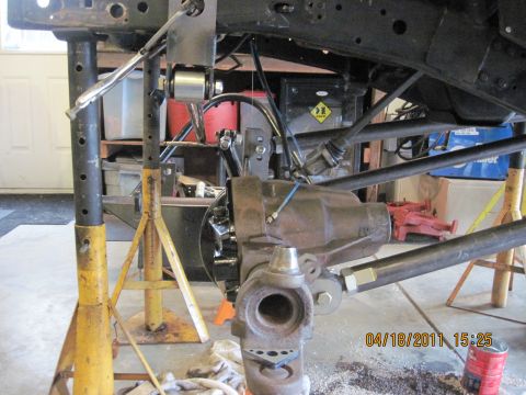 1985 Jeep CJ7 - Close-up view of a Jeep's undercarriage, showing suspension and differential components.
