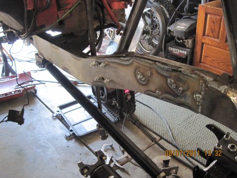 1985 Jeep CJ7 - Close-up of vehicle frame modifications with a date stamp and website visible.