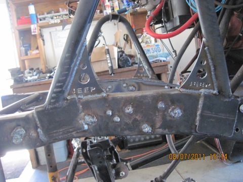 1985 Jeep CJ7 - Custom welded Jeep frame section shows 'JEEP' stamped on triangular brackets.