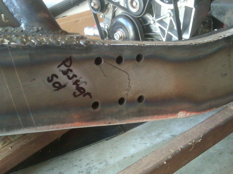 Vehicle frame with handwritten text 'Pssvgr sd' and engine components