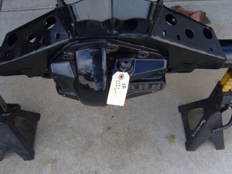 1985 Jeep CJ7 - A black rear axle assembly is supported by jack stands, with a tag indicating 'NO OIL'.