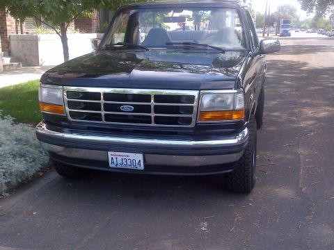 1994 Ford Bronco - This 1994 Ford Bronco features a prominent chrome grille and a Washington state license plate.