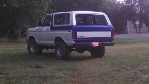 1979 Ford Bronco - Rear view of a two-tone blue and white Ford Bronco from the late 1970s.