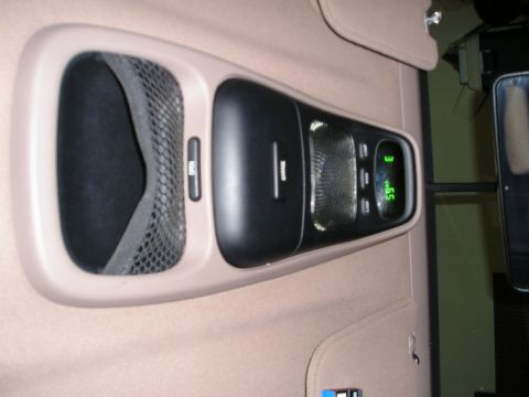 1996 Ford Bronco - The vehicle's overhead console features a storage compartment and a digital display.