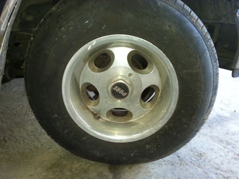 1989 Ford F-150 - Wheel and tire detail with 'PURE' center cap visible.