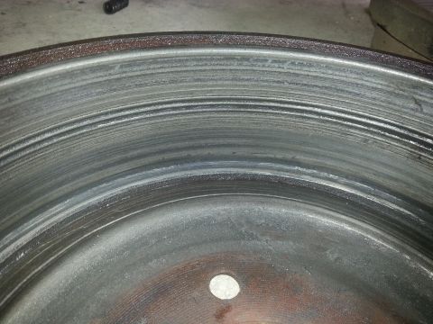 1989 Ford F-150 - This brake rotor shows significant wear and scoring, indicating it is not new.