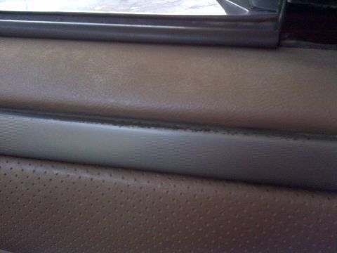 1994 Ford Bronco - Close-up of the interior door panel on a 1994 Ford Bronco.