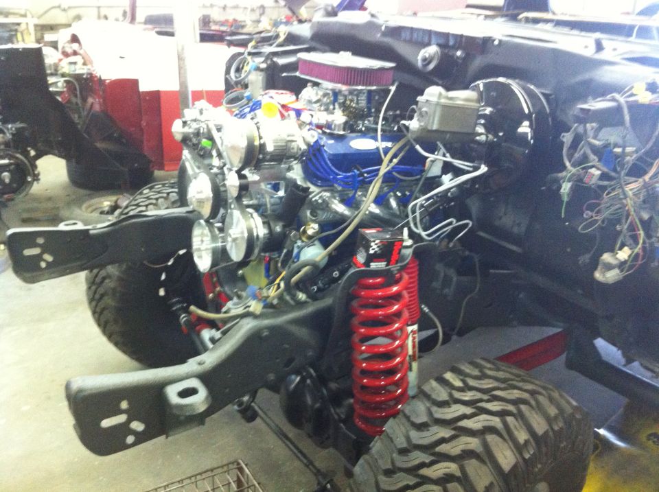 1982 Ford Bronco engine and chassis with red coilover suspension