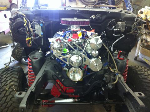 1982 Ford Bronco - Custom V8 engine installed in a vehicle chassis with suspension components visible.