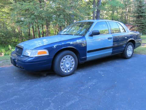 2001 Ford Crown Victoria - This 2001 Ford Crown Victoria has a two-tone blue paint job with the hood and front fender a lighter shade than the rest of the car.