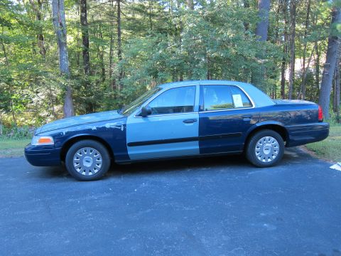 2001 Ford Crown Victoria - This Ford Crown Victoria has a mismatched paint scheme, with the front and rear sections in different shades of blue.