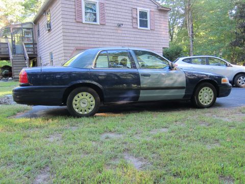 2001 Ford Crown Victoria - This 2001 Ford Crown Victoria has a distinctive two-tone paint job, with the front half a lighter blue and the rear half a darker blue.
