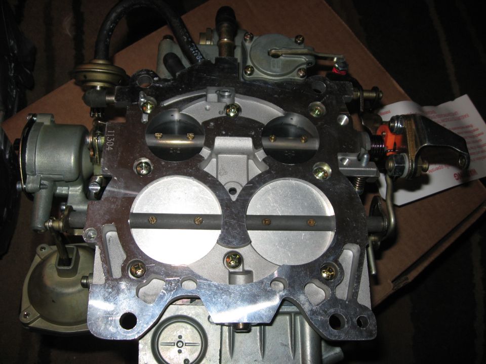 Close-up of a Holley 4150 carburetor with two large circular intake ports