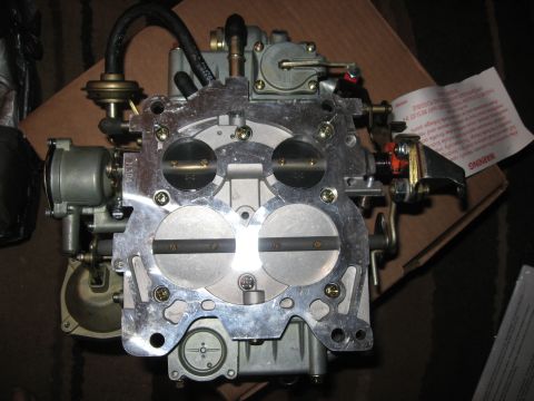 1981 Ford Bronco - A Holley carburetor, likely a performance upgrade part, is shown against a cardboard background.