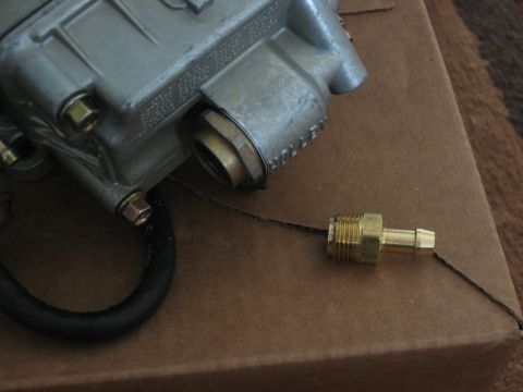 1981 Ford Bronco - Carburetor part with brass fitting and hose.